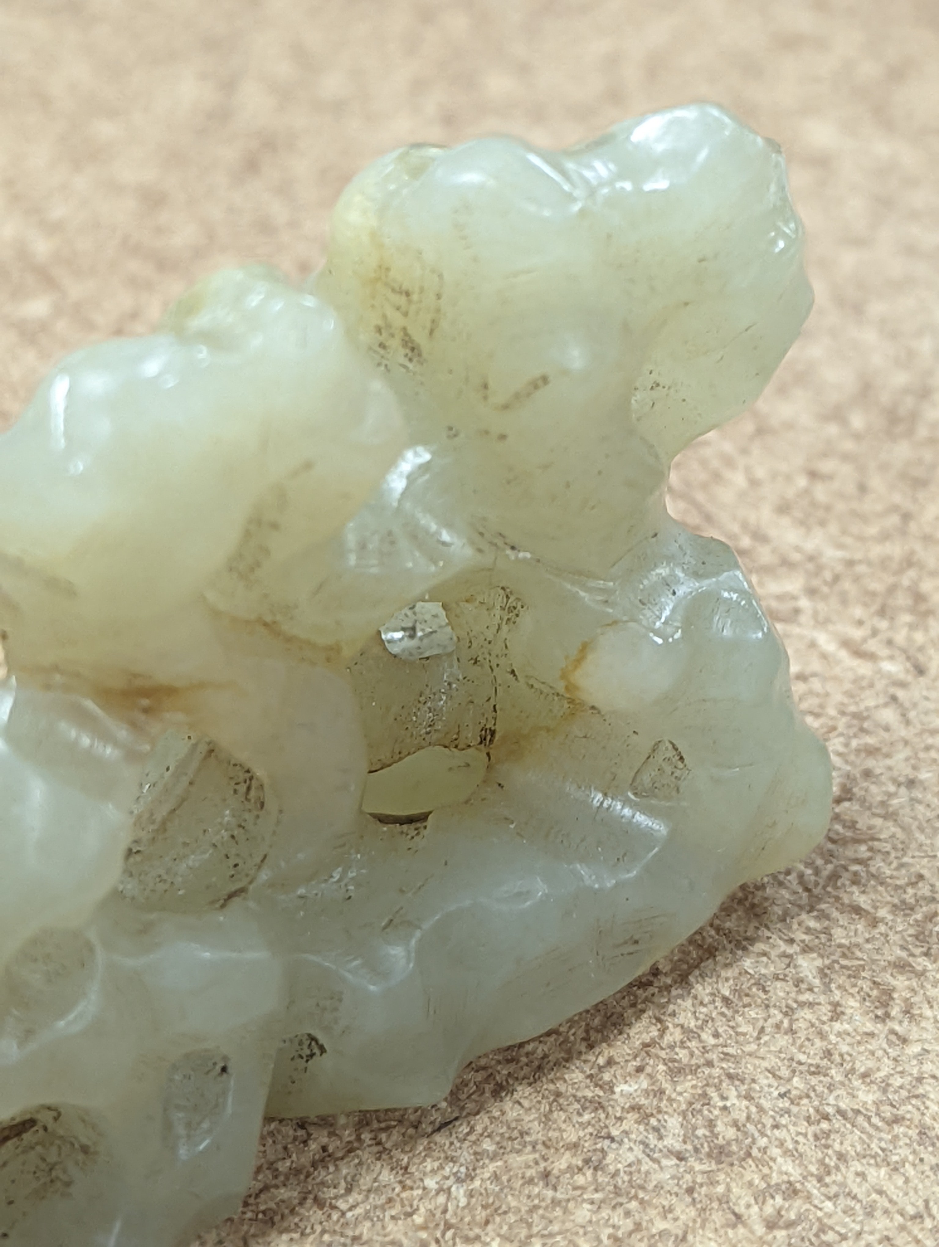 A Chinese celadon jade brush rest, 8cms wide